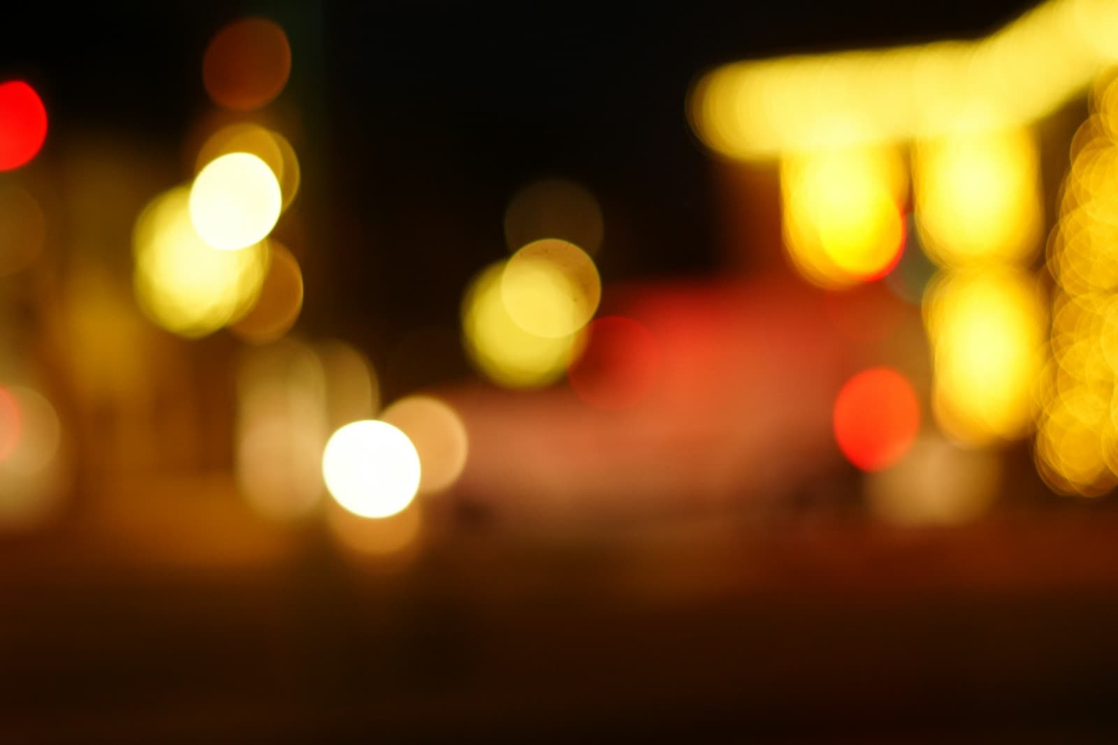 Bucharest nightlife through a rain-speckled window